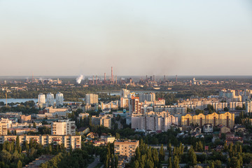 Huge metallurgical production in the city. Smoke from the pipes. environmental pollution. Pollution of the atmosphere and environment. Bad ecology and health problems in the population