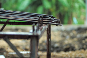 Selective focus on reinforced steel lines put on the metal station