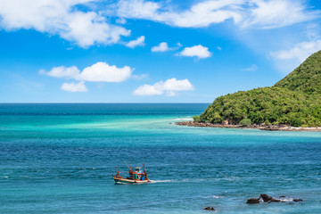 A Colorful Fishing boat moving on the sea