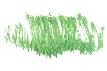 green stroke of the paint brush on white paper