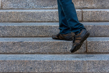 A person climbing the stairs of building as an indication of growing and success