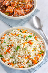Chinese Vegetable Fried Rice in a Bowl with SIde Dish Top View Photo..