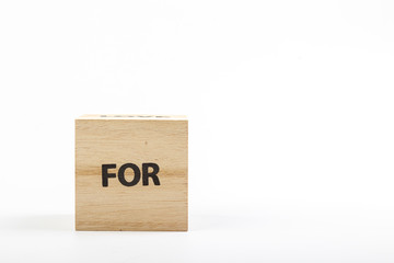 Wooden cubes with the inscription for on a white background