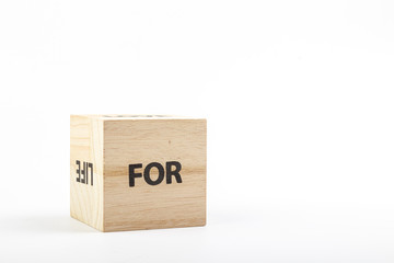 Wooden cubes with the inscription for on a white background