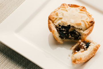 Blueberry mince pie with broken off piece