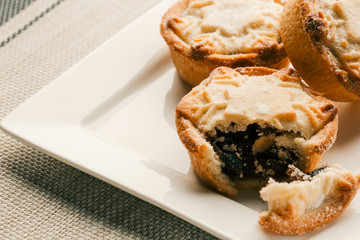 Three mince blueberry piece on the white plate