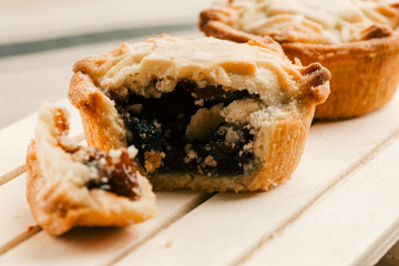 Homemade mince pie with blueberry jam filling on the board