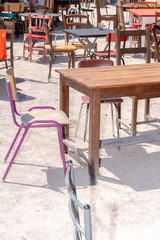 old shabby retro chairs and colorful table restaurant cafe terrace