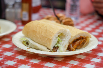 A Sausage Po' Boy Sandwich with Boudin Balls from New Orleans.