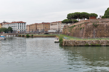 Livorno cityscape with canal and New Fortress, Italy.