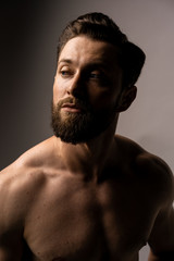 Fototapeta premium Portrait of young bearded man. Retro film filtered.Portrait of a young man with blue eyes .