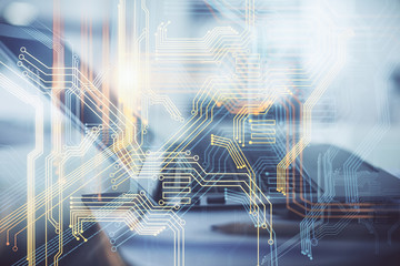 Double exposure of desktop with computer and world map hologram. International data network concept.