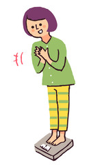 体重計に乗る女性