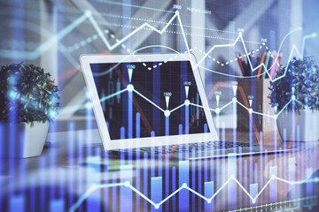 Financial market graph hologram and personal computer on background. Multi exposure. Concept of forex.