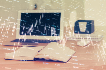 Forex market chart hologram and personal computer background. Multi exposure. Concept of investment.