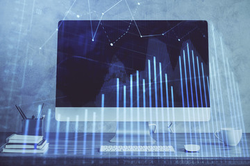 Stock market graph on background with desk and personal computer. Double exposure. Concept of financial analysis.