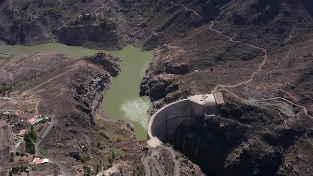 Aerial view of the Presa de Soria (West-East Direction with panning) located in the municipality of Mogan, south of the Canary Island of Gran Canaria (Spain, Europe).