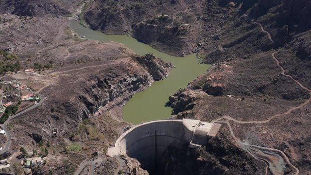Aerial view of the Presa de Soria (West-East Direction with panning) located in the municipality of Mogan, south of the Canary Island of Gran Canaria (Spain, Europe).