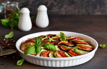 Ratatouille - a traditional vegetable dish of French cuisine. Ratatouille dish of eggplant, zucchini and tomatoes.