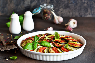 Ratatouille - a traditional vegetable dish of French cuisine. Ratatouille dish of eggplant, zucchini and tomatoes.