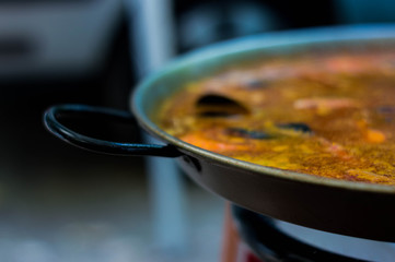 Seafood paella in its paella pan.