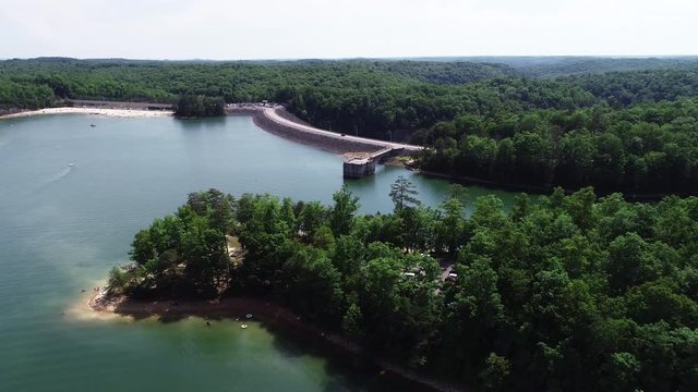 Car drives past Laurel River Lake, aerial