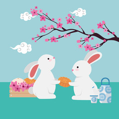 rabbits couple with chinese tree branch and flowers