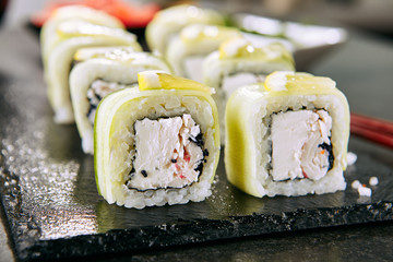 Macro Shot of Snow Crab Uramaki Sushi Rolls in Japanese Restaurant