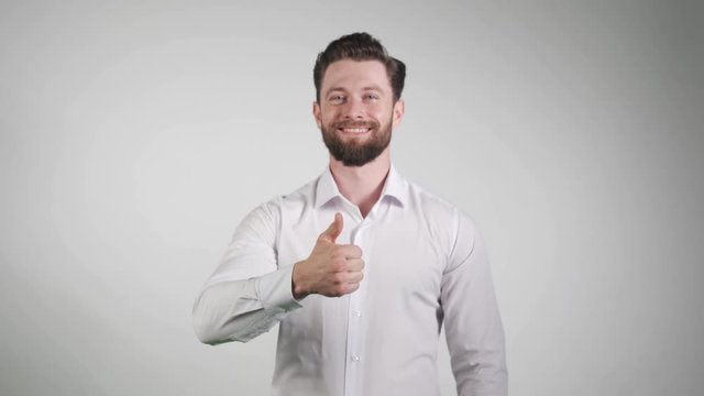 young beautiful happy man thums up isolated on white. Like. Happiness.