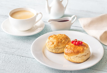 Classic scones with cream and berry jam