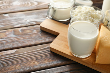 Fresh dairy products on cutting board, close up