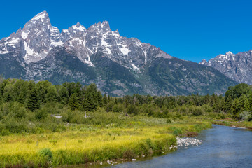 Fototapeta na wymiar Schwabacher landing with river in the foreground and grand tetons in background