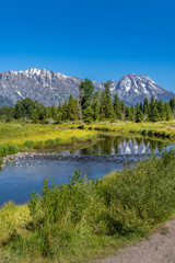 Fototapeta na wymiar Schwabacher landing with river in the foreground and grand tetons in background
