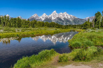 Schwabacher landing with river in the foreground and grand tetons in background