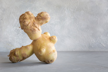 Ugly potatoe. Concept organic vegetables. Close up.