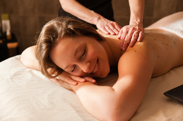 Beautiful young woman receiving a massage.
