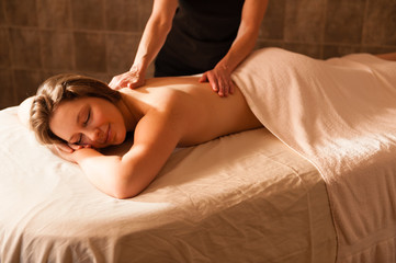 Fototapeta na wymiar Beautiful young woman receiving a massage.