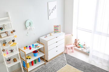 Interior of modern children's room with toys