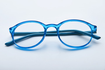 Stylish glasses on light background