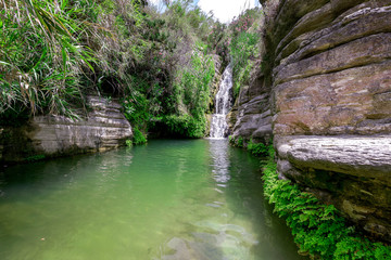 Naklejka na ściany i meble Nature wonderland, lake waterfall in national park