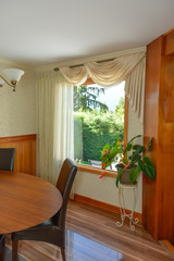 Interior of luxury residential house with look at back yard through the window