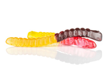 Group of two whole chewing colourful jelly worm candy isolated on white background