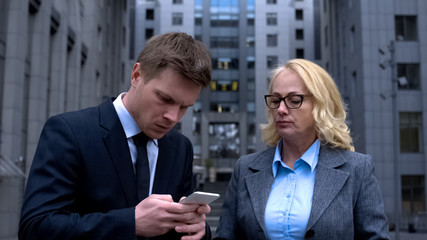 Company employee booking tickets by smartphone app for strict lady boss internet