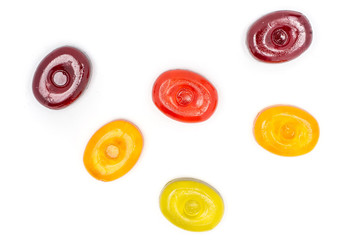 Group of six whole colourful hard candy flatlay isolated on white background