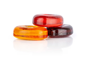 Group of three whole colourful hard candy cherry wine orange isolated on white background