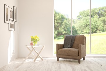 Fototapeta premium Mock up of stylish room in white color with armchair and green landscape in window. Scandinavian interior design. 3D illustration