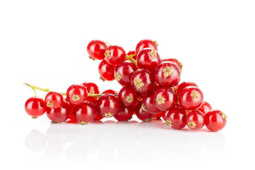 Lot of whole fresh red currant isolated on white background