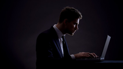 Businessman typing on computer, vision problems, wrong sitting position, health