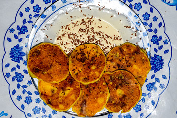 Cheesecakes with sour cream and chocolate chips on plate.