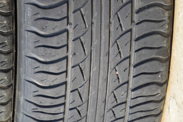 The background of the tread pattern of the car wheel. Rubber tir